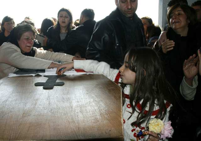 Iraqi Christian relatives grieve over th